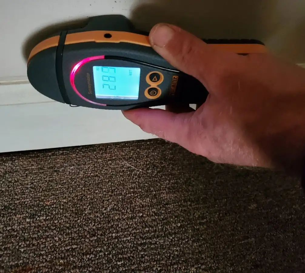 Moisture detection at baseboard during Storm Damage Restoration in Fort Pierce